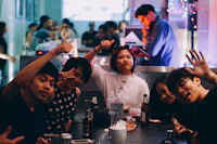 a group of people at a bar