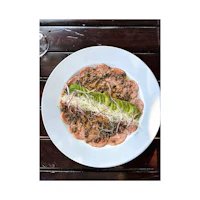 a plate of food on a wooden table