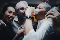 a group of people drinking at a party