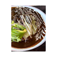 a plate of food with a sauce on it